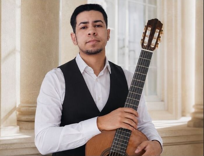 Yannis Koser with classical guitar, teaching in Brussels